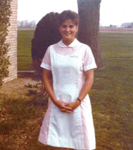 Paige Dooley in nursing uniform