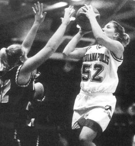 Elizabeth Ramsey '01 playing basketball