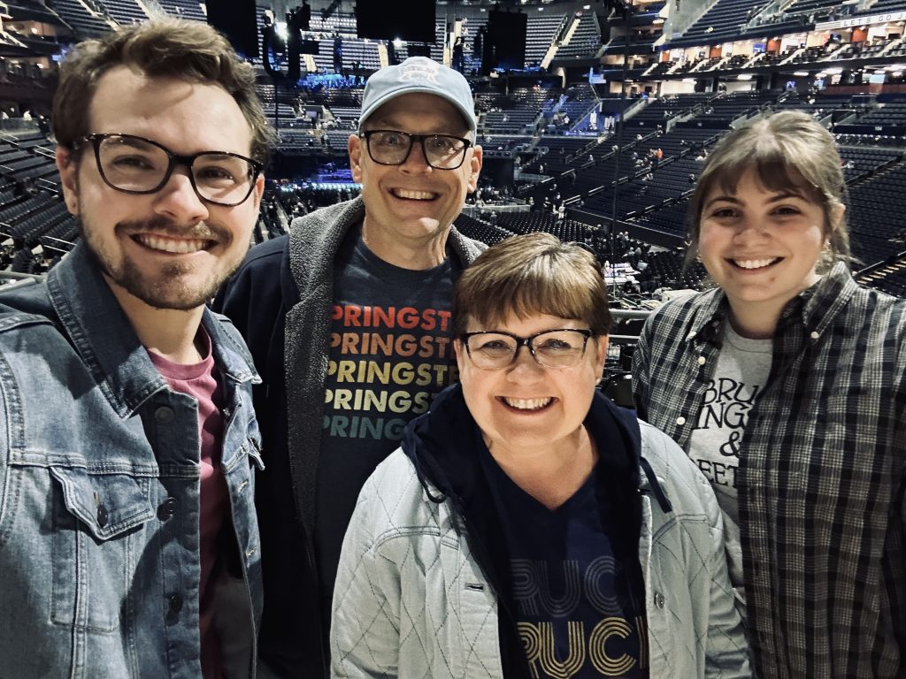 Photo of Stephanie Kendall-Deitz and her family at a Bruce Springsteen concert