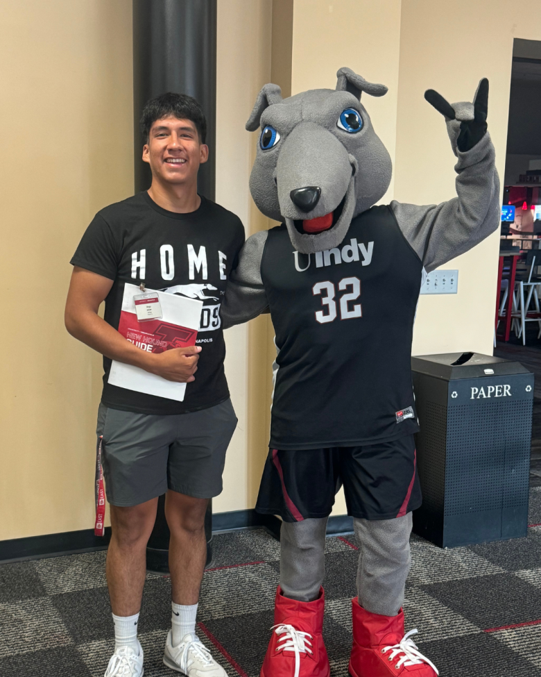 photo of Diego Julian with Ace, UIndy's costumed mascot