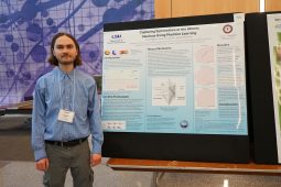 Elliot Steffen standing in front of his research poster