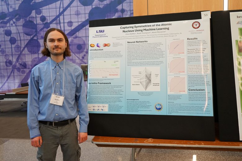 Elliot Steffen standing in front of his research poster